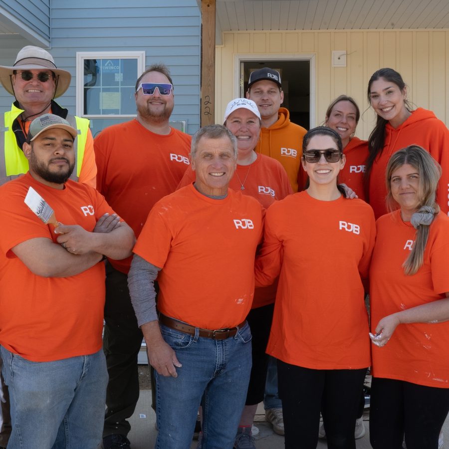 RJB volunteers in orange RJB shirts at a Habitat for Humanity build site